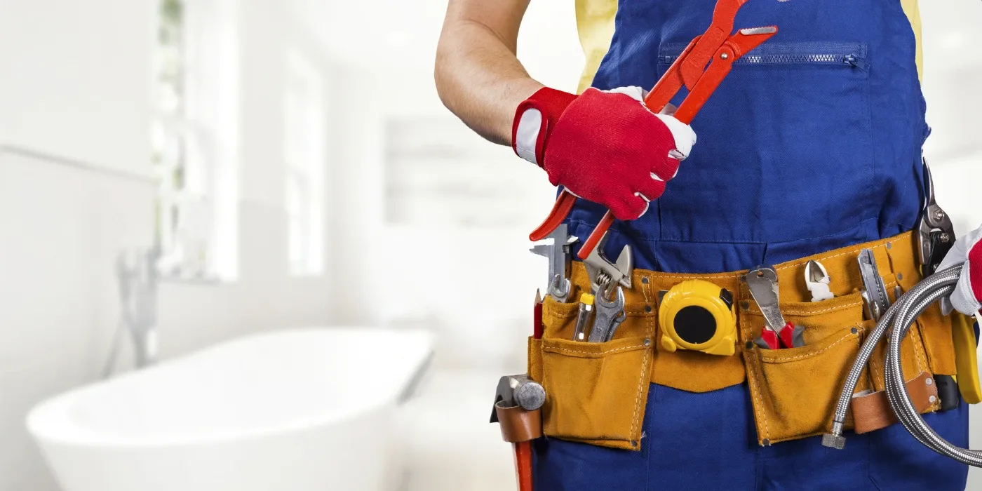 The torso of plumbing technician showing a tool belt from Emergency Plumber Austin in Austin, TX - Residential Plumbing Services